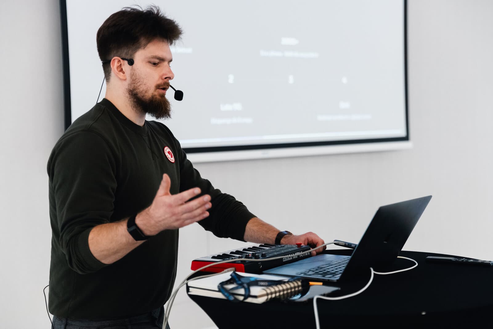 Jarosław Michalik leading a live session at a laptop